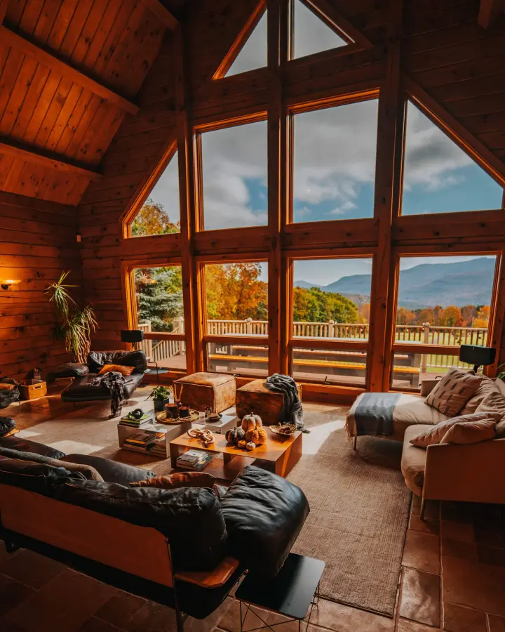 The living room with the cathedral windows and high ceilings is the heart of the home.