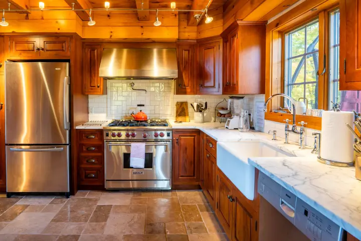 Professional Wolf range with 6 burners - the faucet over the stove makes it easy to fill up a large pot of water - pasta for 10 coming right up!