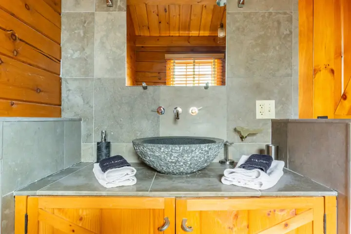 The beautiful limestone tiles and granite sink are some of the many design details that were imported from Italy.