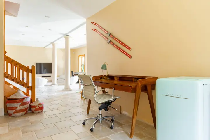 This is another desk and comfortable office chair - working from home remotely has become so easy. The skis on the wall may give extra inspiration or motivation!
