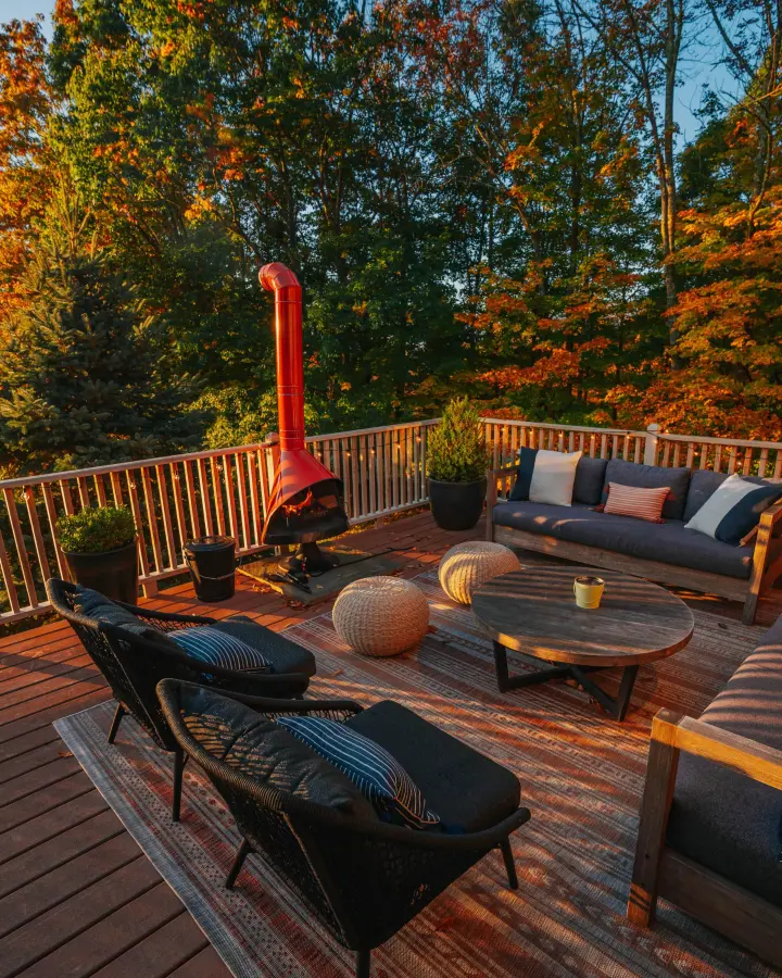 Imagine enjoying a glass of wine in this cozy lounge area on the front deck. The mid-century modern chiminea is perfect for keeping warm on chilly spring or fall evenings.