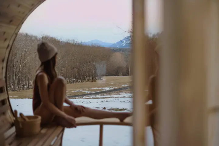 This may be the seat with the best view. Our new cedar barrel sauna with a panoramic window that makes you feel directly in nature. Enjoy the warmth year round.