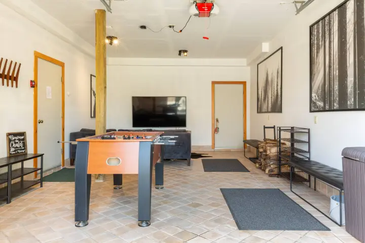 The garage turned entertainment room with a new Kick Legend 55" Foosball table and second TV. The best place to unwind after a day of skiing or hiking (after the hot tub that is!).